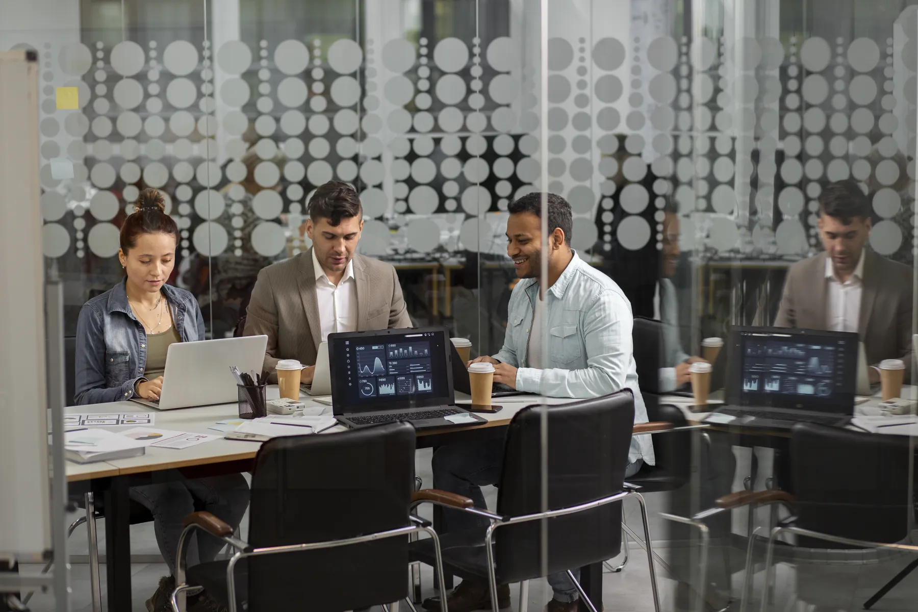 Engineering team collaborating in a technology facility